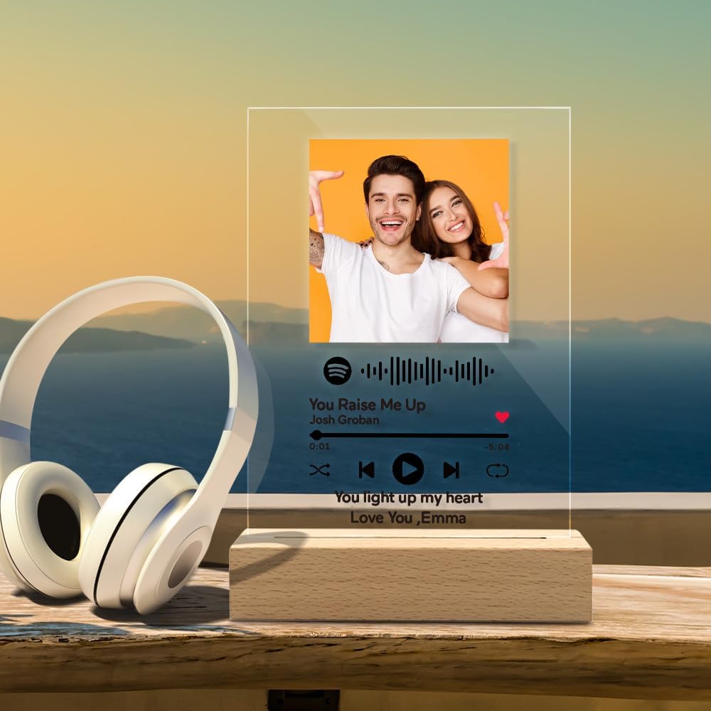 Custom LED music photo plaque on a wooden base beside headphones