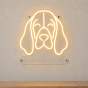 MEON NEON-watermarked concept mockup of a Warm White Basset Hound head LED neon sign with a blank acrylic area for a UV-printed breed caption or dog name.