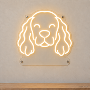 MEON NEON-watermarked concept mockup of a Warm White Cocker Spaniel head LED neon sign with a blank acrylic area for a UV-printed breed caption or dog name.