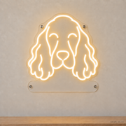 MEON NEON-watermarked concept mockup of a Warm White English Cocker Spaniel head LED neon sign with a blank acrylic area for a UV-printed breed caption or dog name.