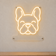 MEON NEON-watermarked concept mockup of a Warm White French Bulldog head LED neon sign with a blank acrylic area for a UV-printed breed caption or dog name.