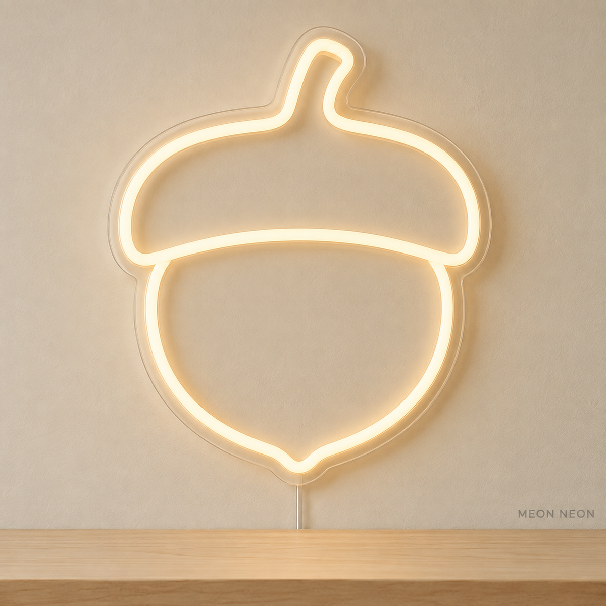 Watermarked concept mockup of Mini Acorn LED Neon Sign in Warm White on a clear acrylic backboard.