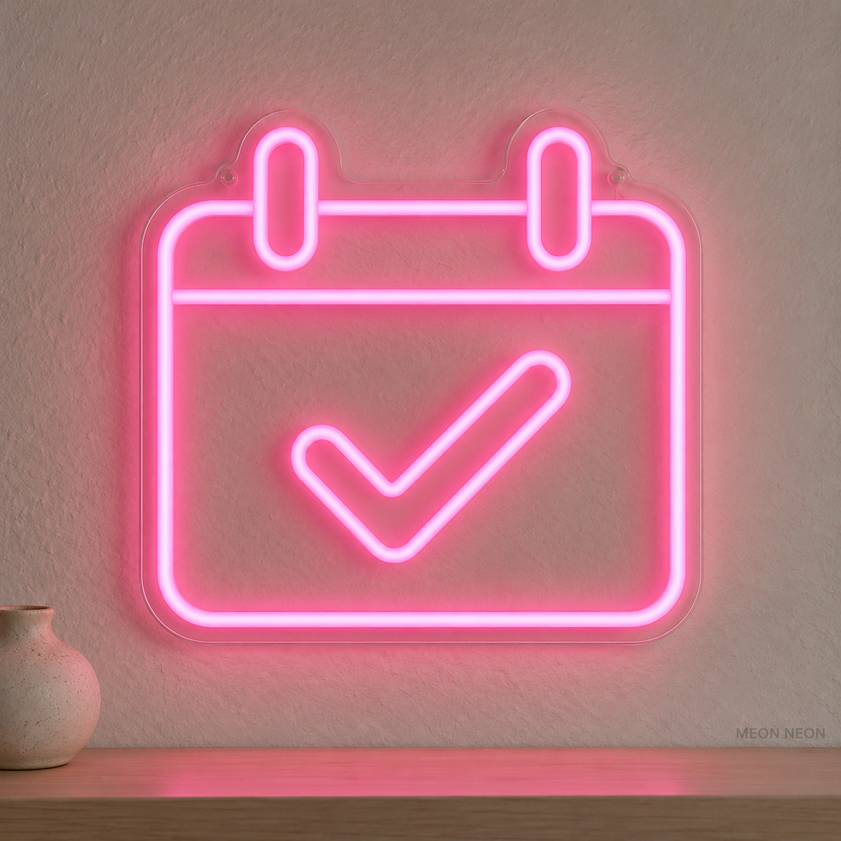 Watermarked concept mockup of Mini Appointment Calendar LED Neon Sign in Pink on a clear acrylic backboard.