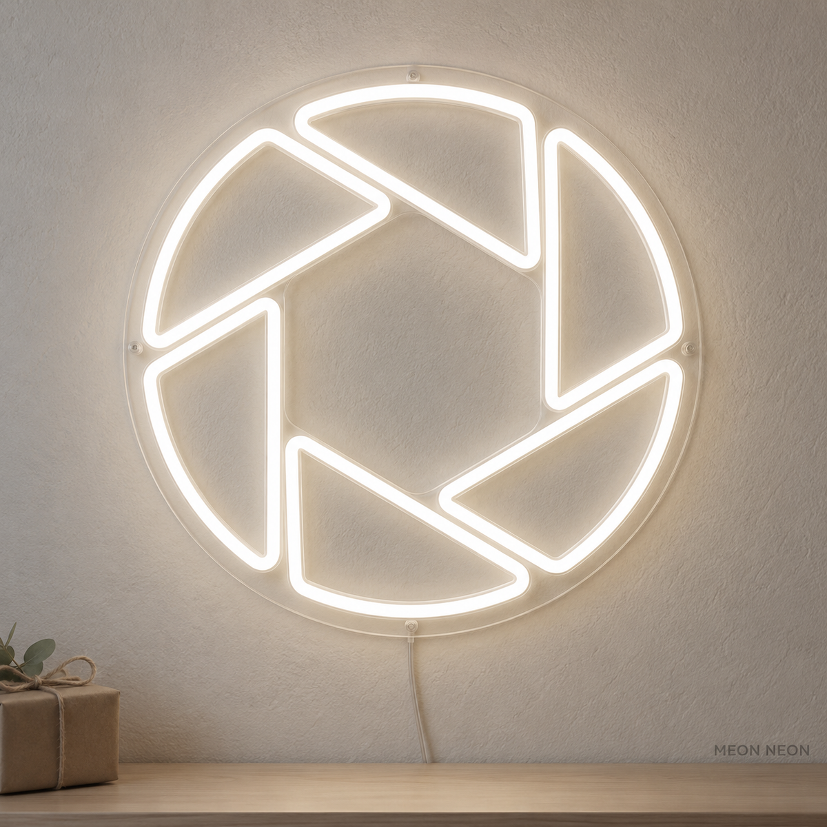 Watermarked concept mockup of the Mini Camera Aperture LED Neon Sign in White on a clear acrylic backboard.