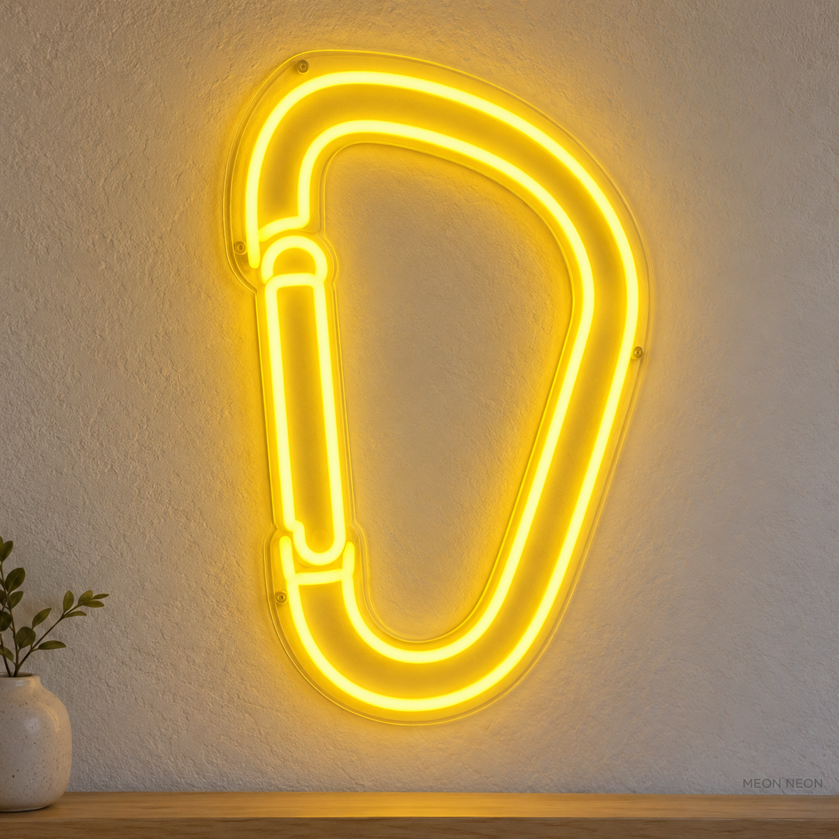 Watermarked concept mockup of Mini Carabiner LED Neon Sign in Yellow on a clear acrylic backboard.