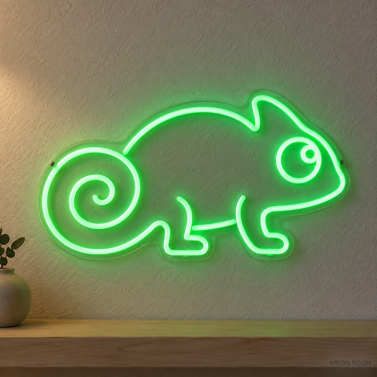 Watermarked concept mockup of Mini Chameleon LED Neon Sign in Green on a clear acrylic backboard.