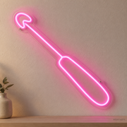 Watermarked concept mockup of Mini Crochet Hook LED Neon Sign in Pink on a clear acrylic backboard.