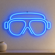Watermarked concept mockup of Mini Diving Mask LED Neon Sign in Blue on a clear acrylic backboard.