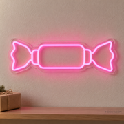 Watermarked concept mockup of the Mini Holiday Cracker LED Neon Sign in Pink on a clear acrylic backboard.