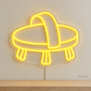 Watermarked concept mockup of Mini Horse Brush LED Neon Sign in Yellow on a clear acrylic backboard.