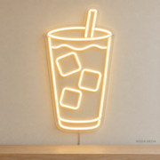 Watermarked concept mockup of Mini Iced Latte LED Neon Sign in Warm White on a clear acrylic backboard.