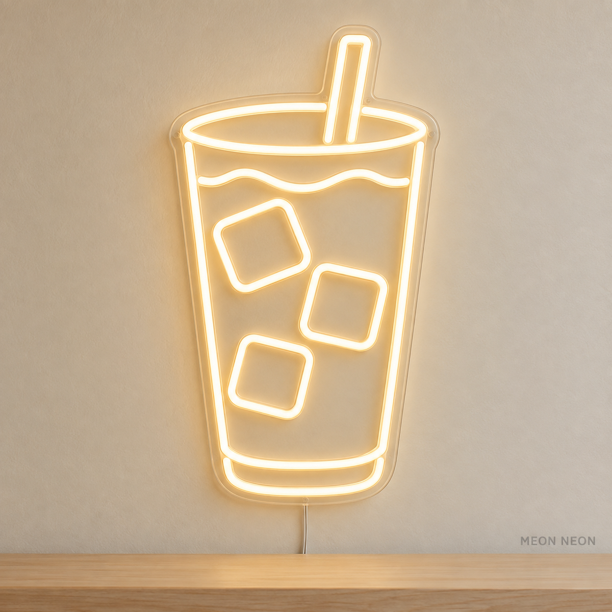 Watermarked concept mockup of Mini Iced Latte LED Neon Sign in Warm White on a clear acrylic backboard.