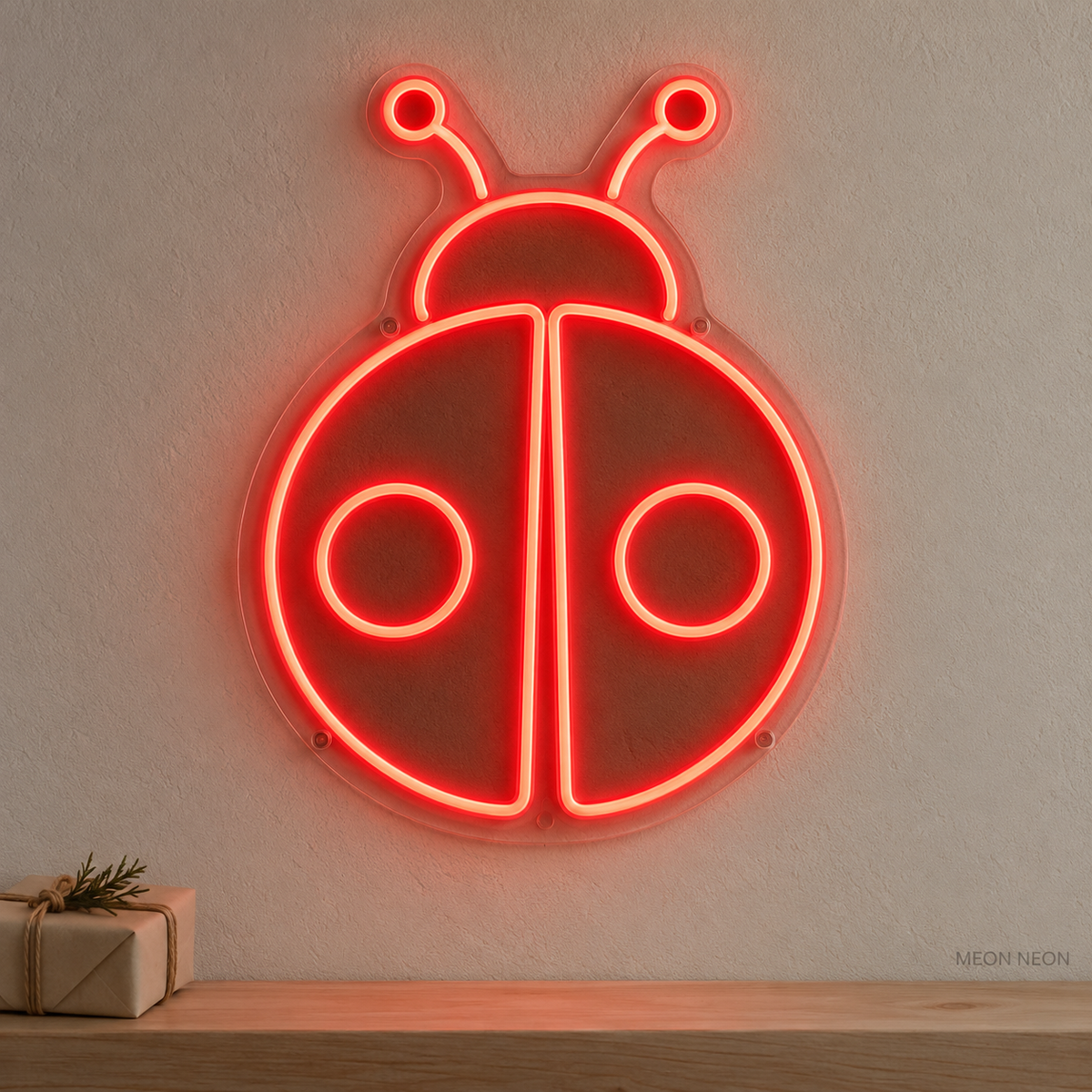 Watermarked concept mockup of the Mini Ladybug LED Neon Sign in Red on a clear acrylic backboard.