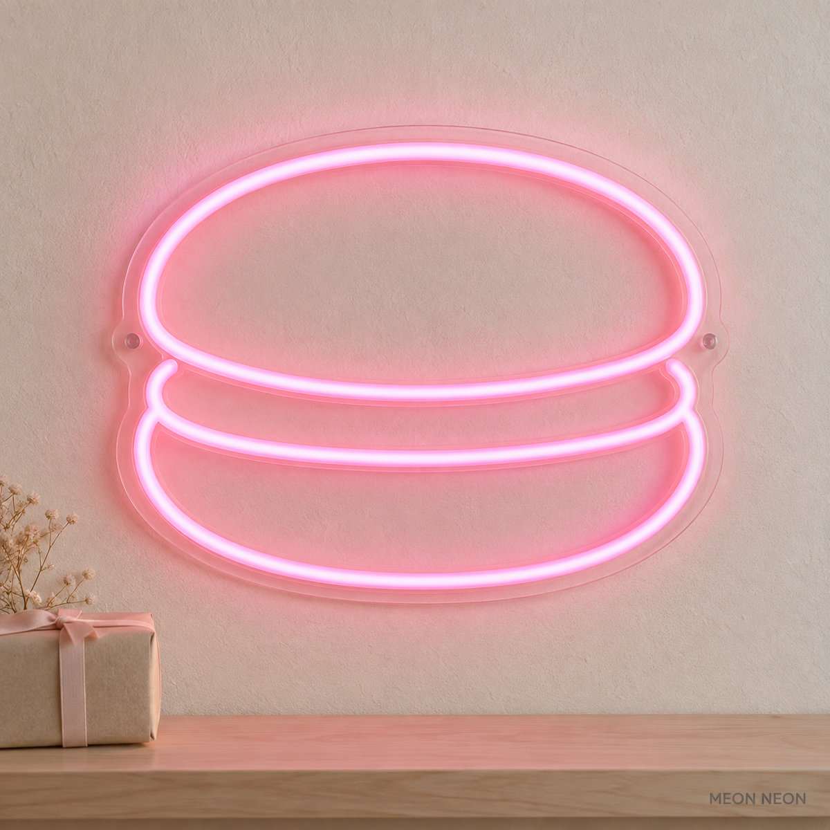 Watermarked concept mockup of the Mini Macaron LED Neon Sign in Pink on a clear acrylic backboard.