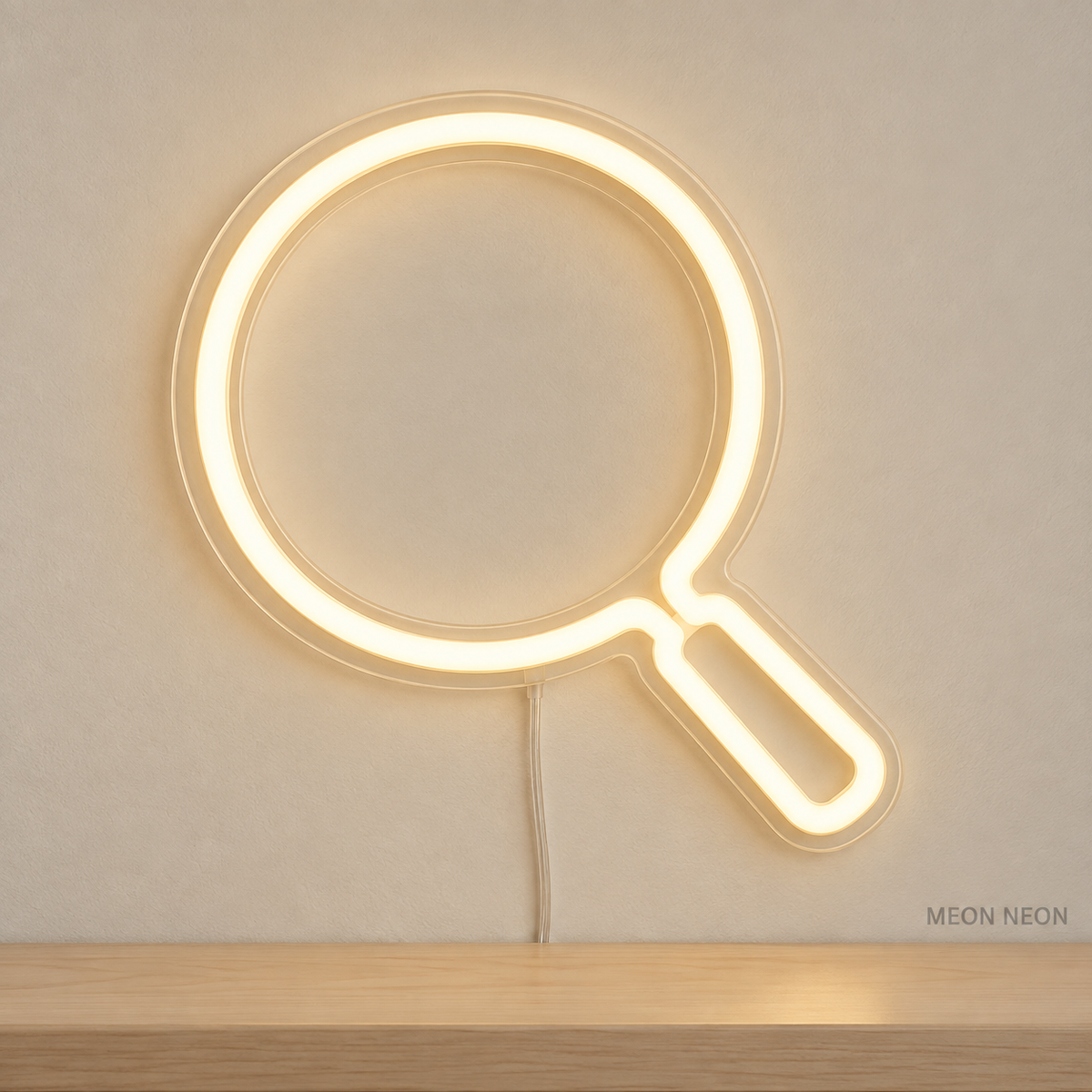 Watermarked concept mockup of Mini Magnifying Glass LED Neon Sign in Warm White on a clear acrylic backboard.