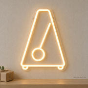 Watermarked concept mockup of the Mini Metronome LED Neon Sign in Warm White on a clear acrylic backboard.