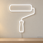Watermarked concept mockup of Mini Paint Roller LED Neon Sign in White on a clear acrylic backboard.