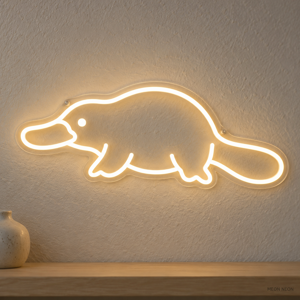 Watermarked concept mockup of Mini Platypus LED Neon Sign in Warm White on a clear acrylic backboard.
