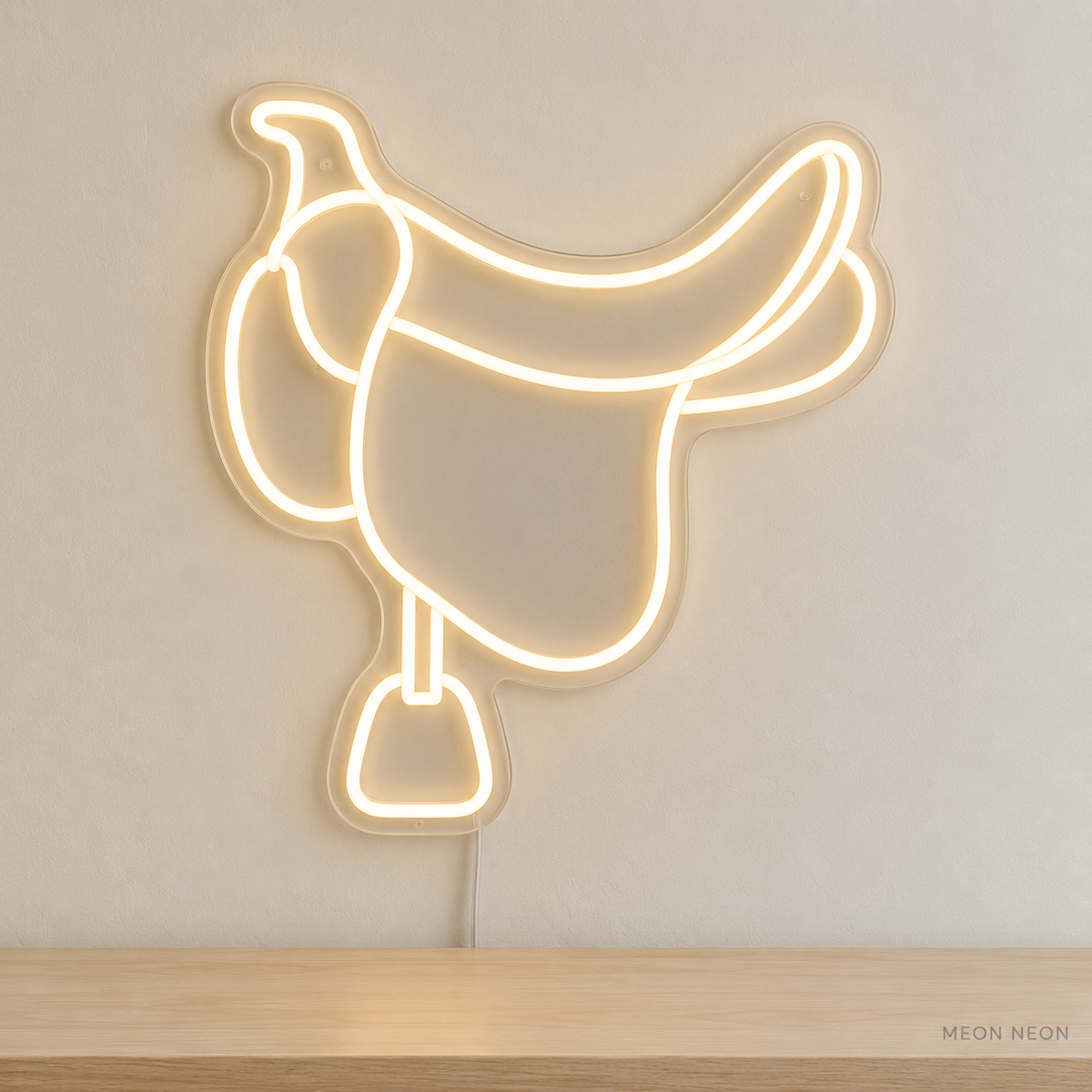 Watermarked concept mockup of Mini Saddle LED Neon Sign in Warm White on a clear acrylic backboard.