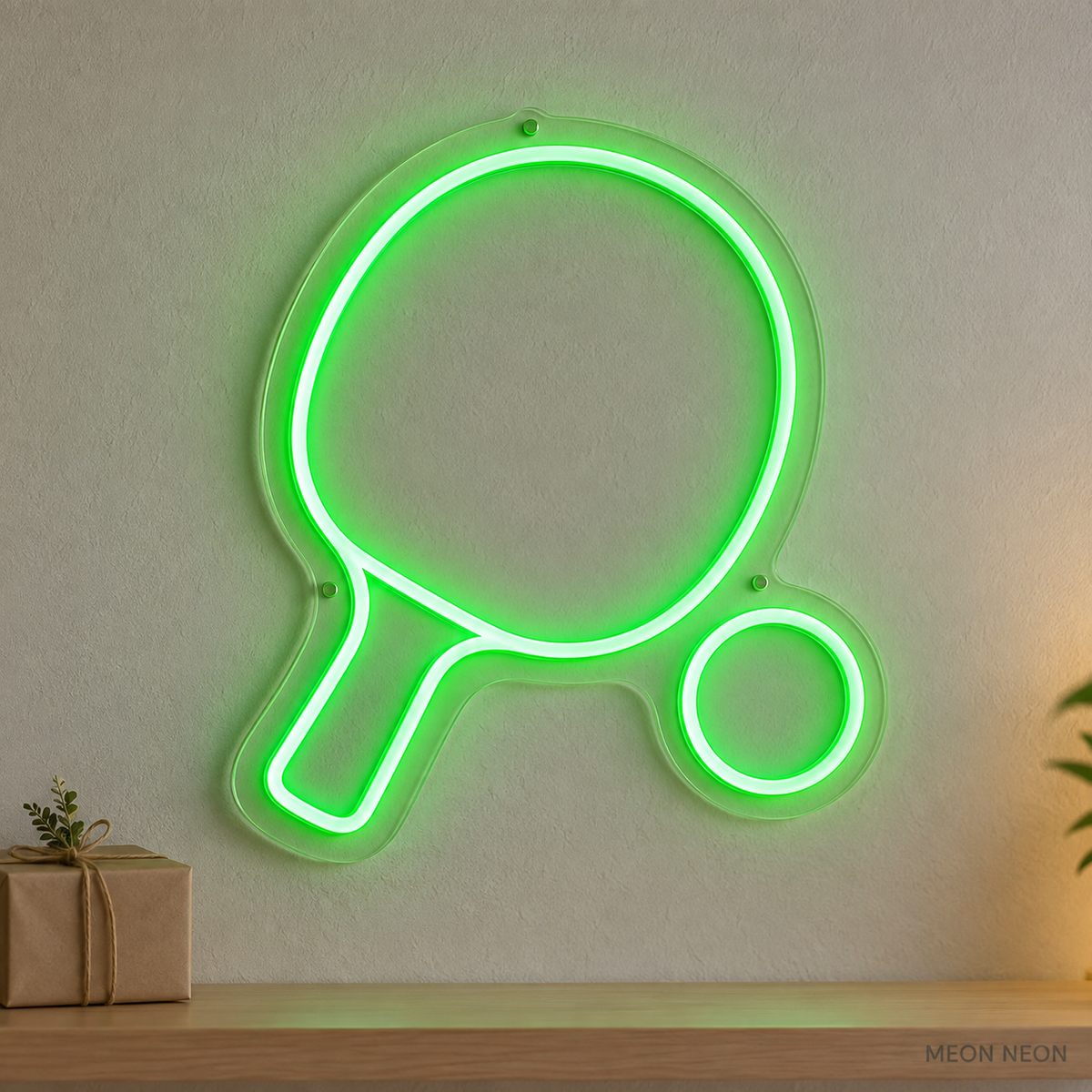 Watermarked concept mockup of the Mini Table Tennis Paddle LED Neon Sign in Green on a clear acrylic backboard.