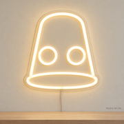 Watermarked concept mockup of Mini Thimble LED Neon Sign in Warm White on a clear acrylic backboard.