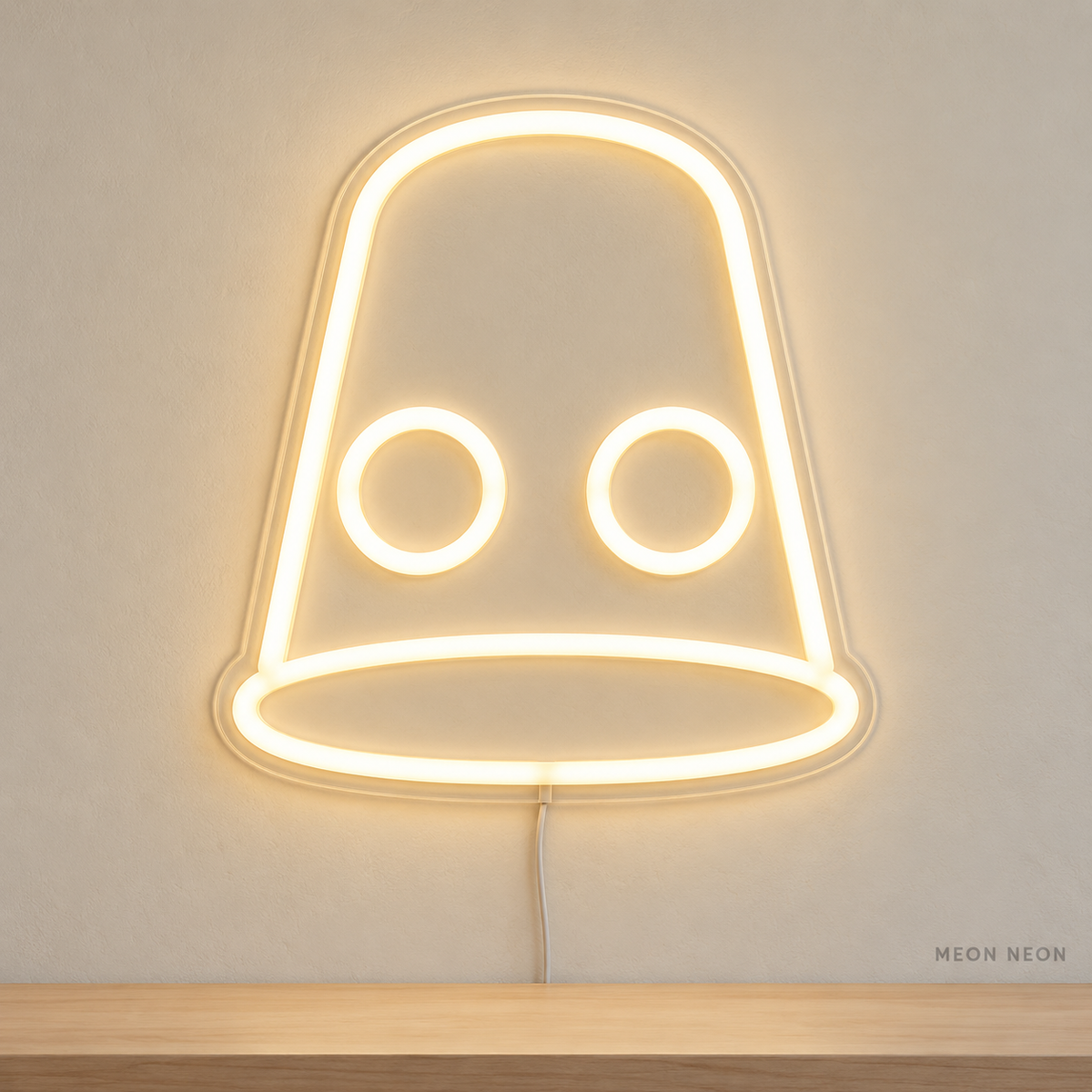 Watermarked concept mockup of Mini Thimble LED Neon Sign in Warm White on a clear acrylic backboard.